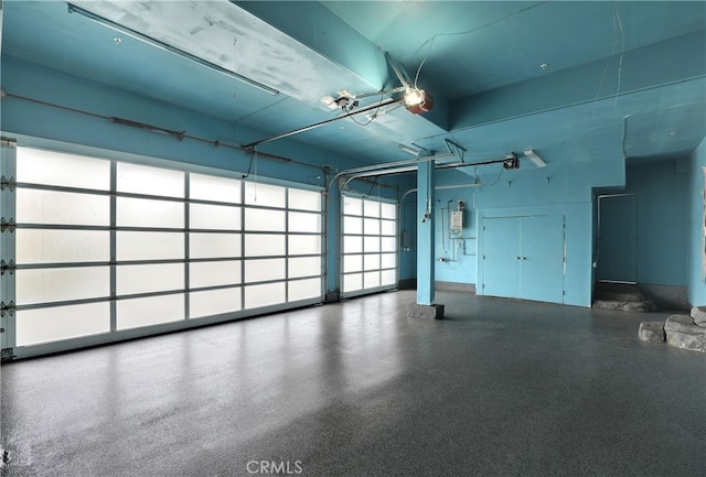 205 Esplanade, San Clemente, CA 92672 - garage featuring a garage door opener and water heater
