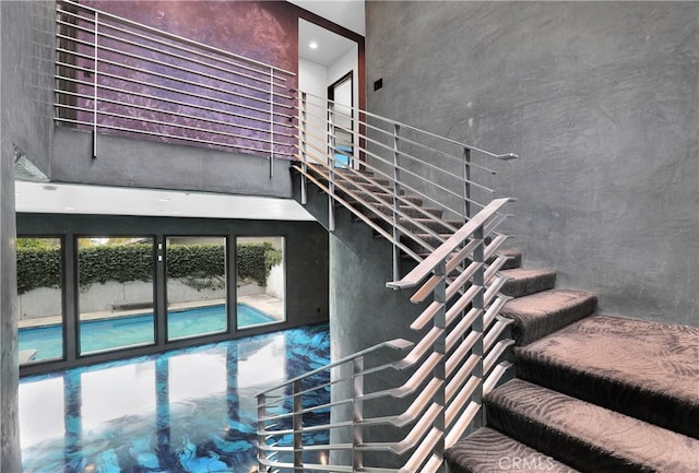 205 Esplanade, San Clemente, CA 92672 - staircase featuring a high ceiling and a healthy amount of sunlight