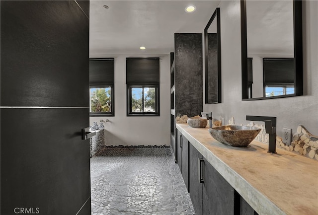 205 Esplanade, San Clemente, CA 92672 - bathroom with stone finish floor, vanity, and recessed lighting