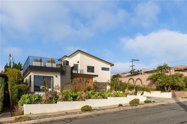 4414 Monaco St, San Diego, CA 92107 - back of house featuring a balcony and stucco siding