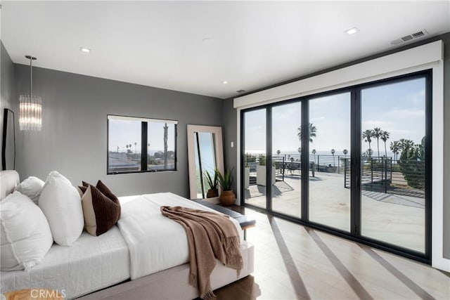 bedroom featuring access to exterior, visible vents, an inviting chandelier, and light wood-style floors
