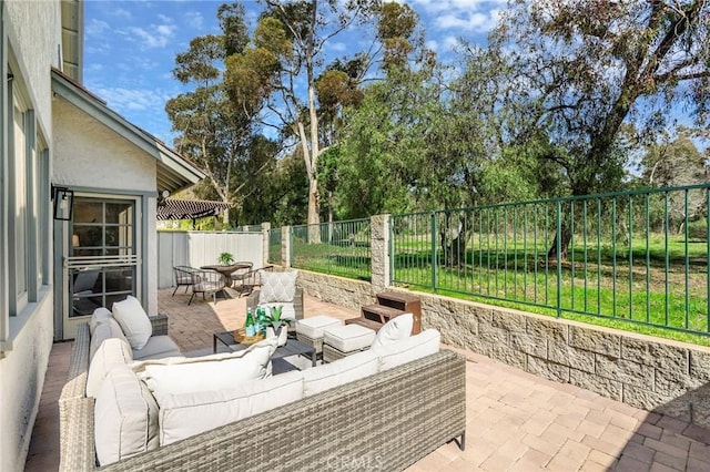 view of patio with an outdoor hangout area and a fenced backyard