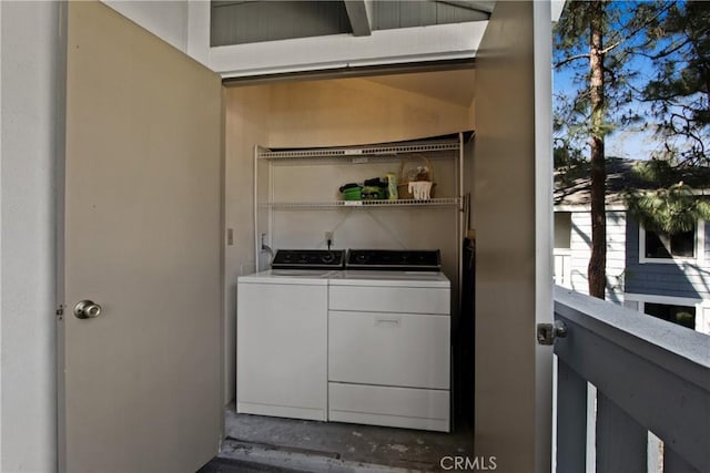 clothes washing area featuring laundry area and washer and dryer