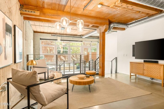 interior space with finished concrete flooring, beamed ceiling, wooden ceiling, and an inviting chandelier