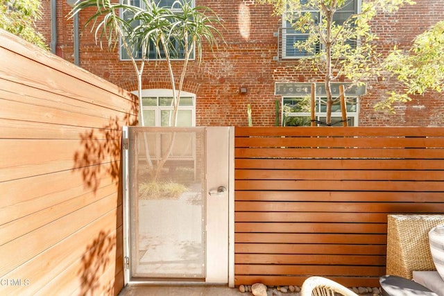 view of gate with fence