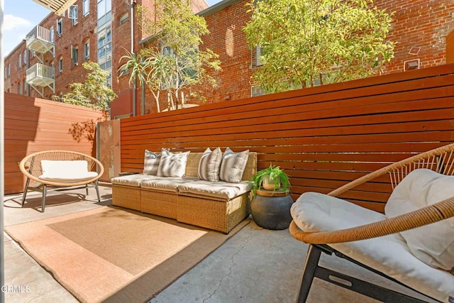 balcony featuring outdoor lounge area and a patio