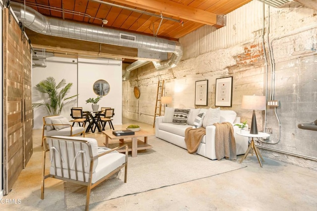 interior space with visible vents and unfinished concrete floors