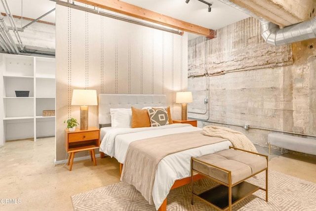 bedroom featuring concrete flooring