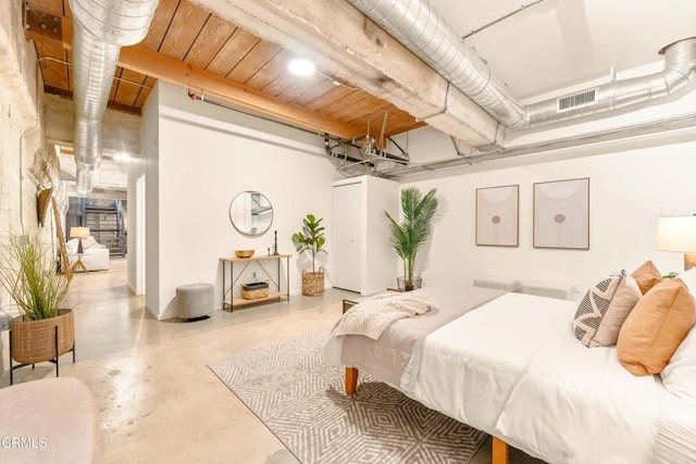 bedroom featuring concrete flooring and visible vents