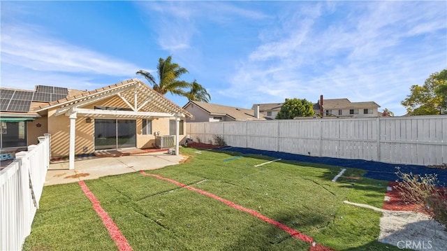 view of yard with a patio area and a fenced backyard