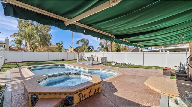 view of pool featuring an in ground hot tub, a patio, and a fenced backyard