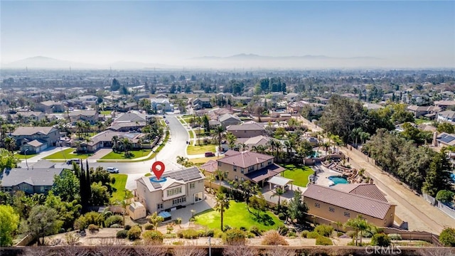 drone / aerial view featuring a residential view and a mountain view