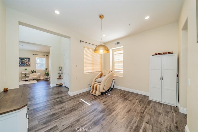 unfurnished room with recessed lighting, visible vents, baseboards, and wood finished floors