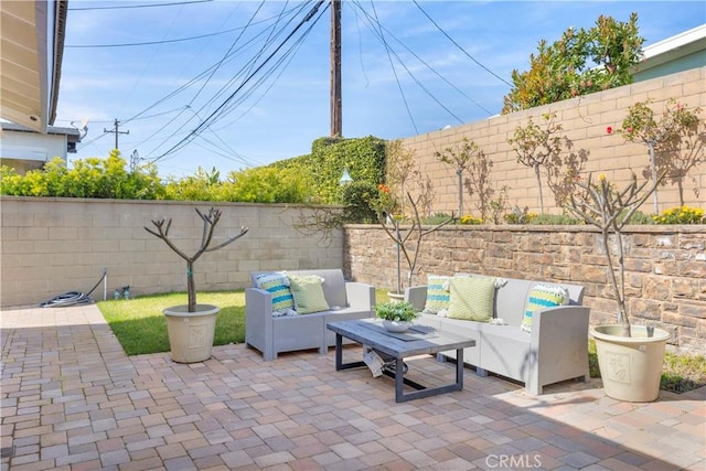 view of patio / terrace featuring a fenced backyard and outdoor lounge area