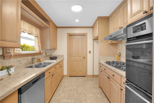 kitchen featuring under cabinet range hood, light brown cabinets, appliances with stainless steel finishes, and a sink