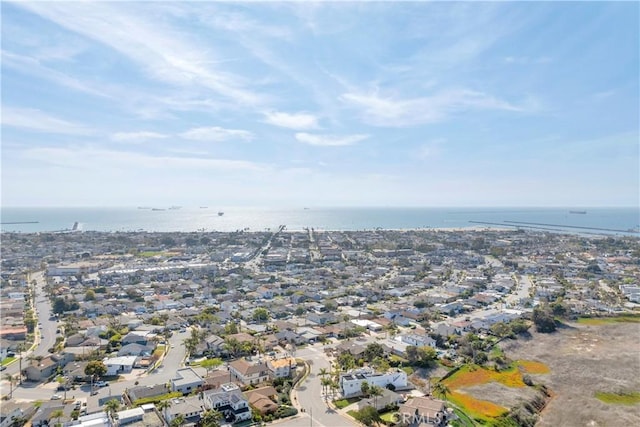 drone / aerial view featuring a residential view and a water view