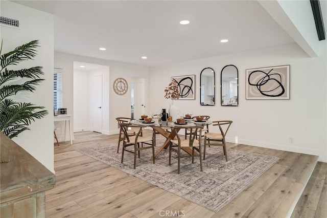 dining area featuring light wood-type flooring, visible vents, baseboards, and recessed lighting