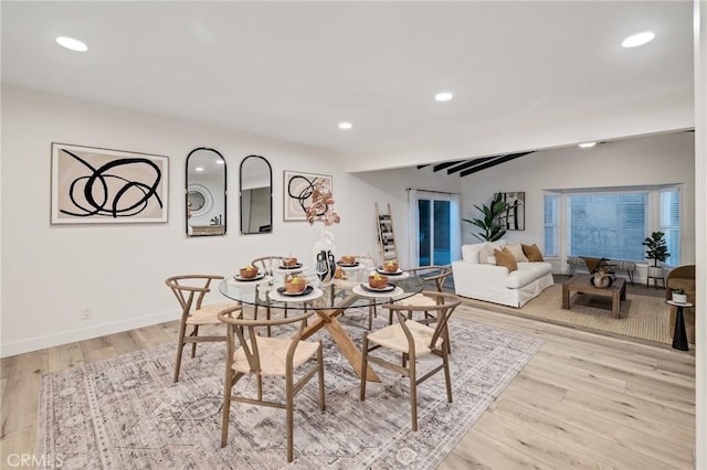 dining area with recessed lighting, light wood-style flooring, and baseboards