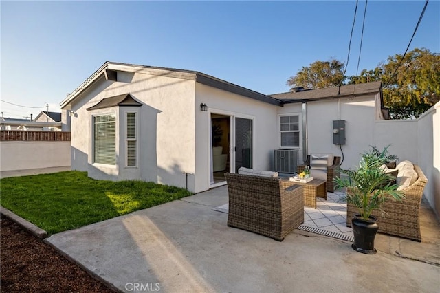 rear view of house featuring a patio, fence, cooling unit, an outdoor living space, and stucco siding