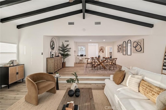 living room featuring recessed lighting, visible vents, vaulted ceiling with beams, and light wood-style flooring