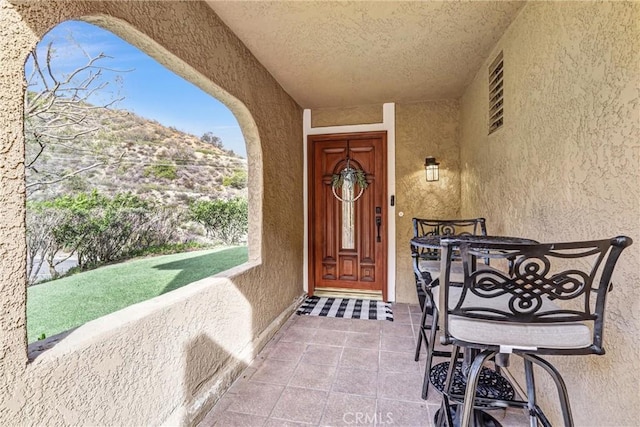 doorway to property with stucco siding