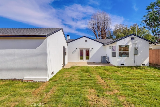 back of house featuring french doors, a yard, a patio, stucco siding, and crawl space