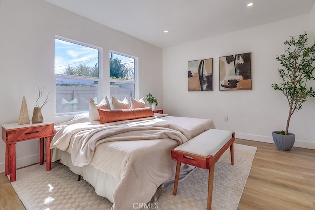 bedroom featuring recessed lighting, baseboards, and light wood finished floors