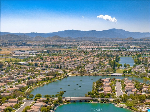 birds eye view of property featuring a residential view and a water and mountain view