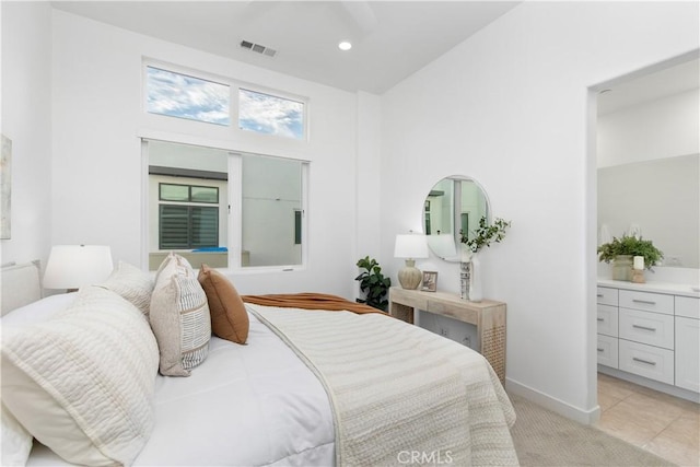 bedroom with light tile patterned floors, recessed lighting, light colored carpet, visible vents, and baseboards