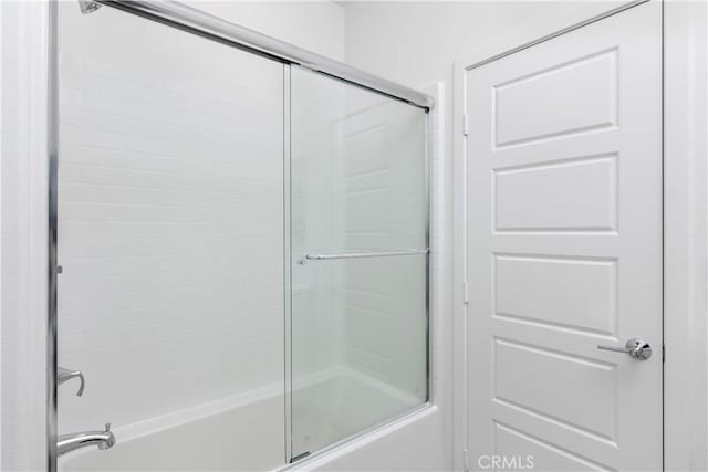 full bathroom featuring shower / bath combination with glass door