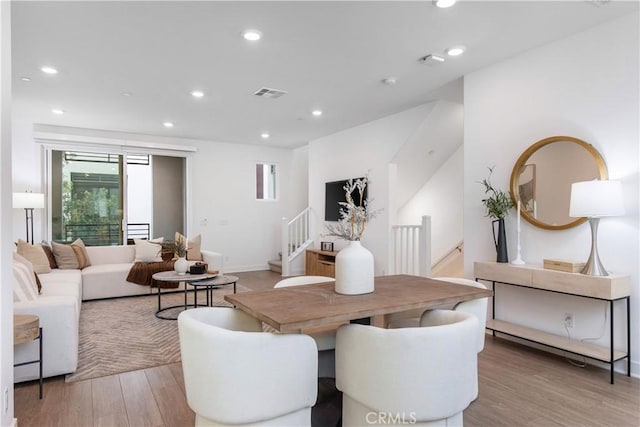 dining space featuring recessed lighting, visible vents, and light wood-style flooring