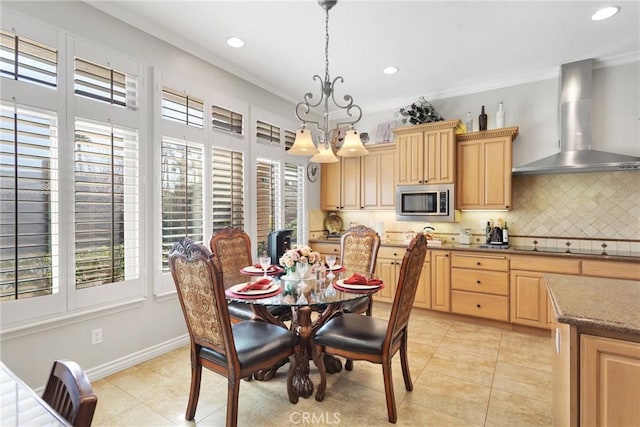 dining room featuring light tile patterned floors, ornamental molding, and recessed lighting