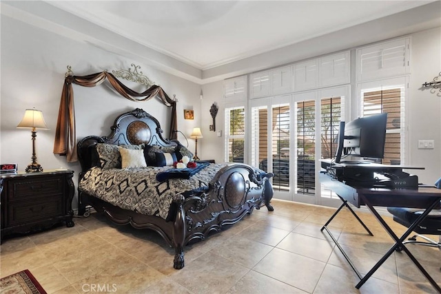 bedroom with light tile patterned floors and access to outside