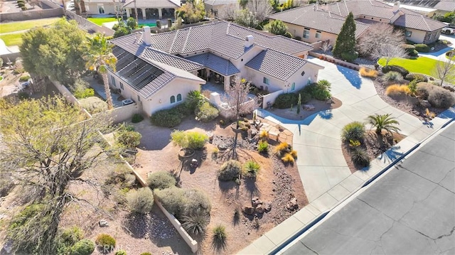 birds eye view of property with a residential view