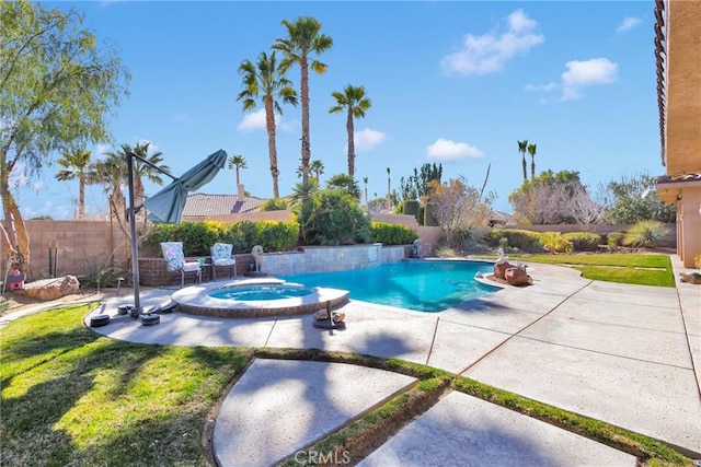 view of swimming pool with a patio area, a fenced backyard, a pool with connected hot tub, and a yard