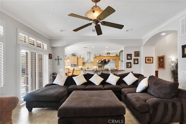 living area with light tile patterned floors, visible vents, crown molding, and recessed lighting