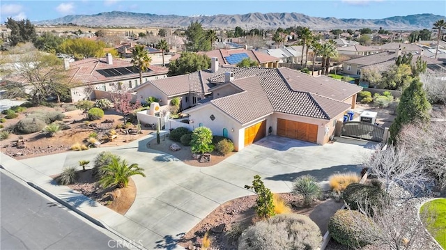 drone / aerial view with a residential view and a mountain view