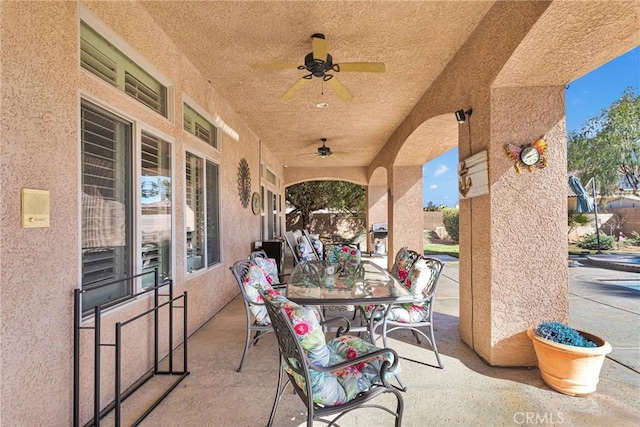 view of patio / terrace featuring outdoor dining area and ceiling fan