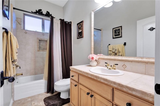 full bath featuring tile patterned flooring, vanity, toilet, and shower / tub combo with curtain