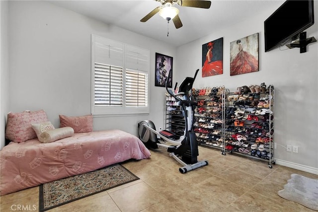 bedroom featuring a ceiling fan, light tile patterned flooring, and baseboards