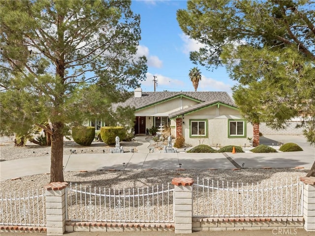 ranch-style house with a fenced front yard, a chimney, and stucco siding