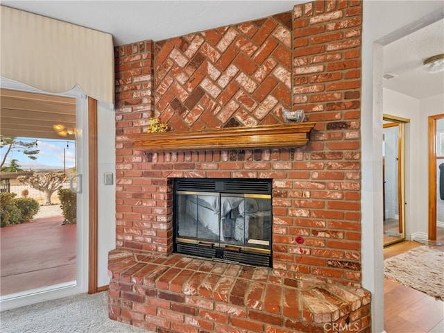 details with visible vents, a fireplace, and baseboards