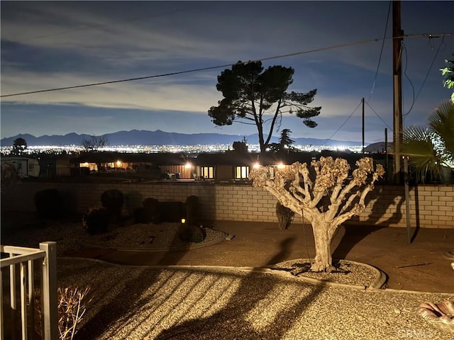 exterior space featuring brick siding and a mountain view