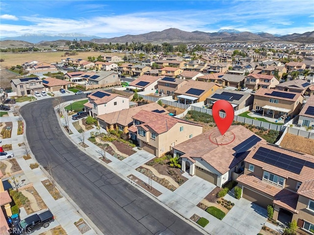 drone / aerial view with a residential view and a mountain view