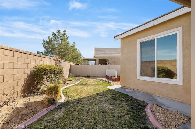 view of yard with a fenced backyard