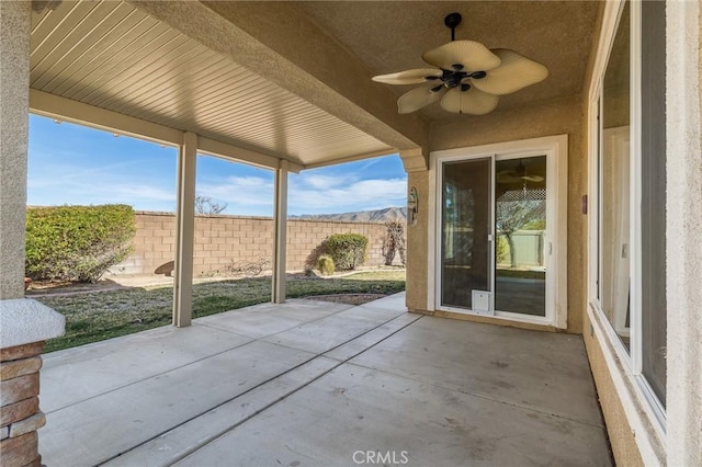 view of patio / terrace with a fenced backyard and ceiling fan