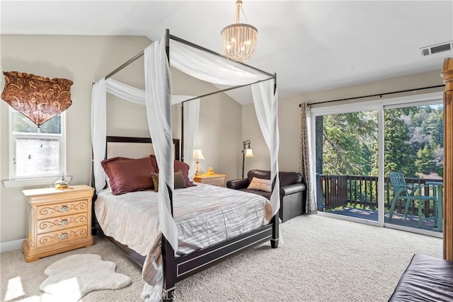 carpeted bedroom with access to outside, visible vents, an inviting chandelier, and multiple windows