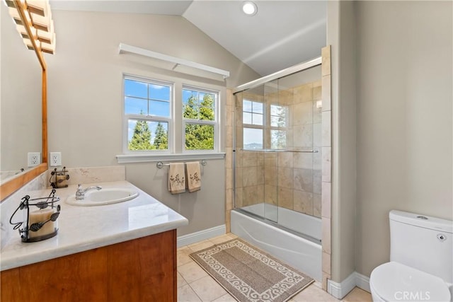 bathroom with toilet, shower / bath combination with glass door, tile patterned floors, vaulted ceiling, and vanity