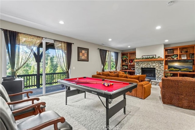 rec room featuring recessed lighting, pool table, and a stone fireplace