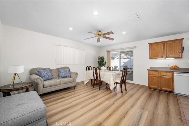 living room with a ceiling fan, recessed lighting, visible vents, and light wood-style floors